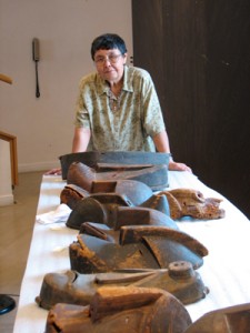 Alutiiq artist Helen Simeonoff with masks discovered in France
